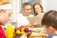 Family at breakfast table uid 1343823